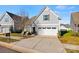 Charming two-story home with attached garage, well-manicured lawn, and modern curb appeal at 27467 Cinderella Cir, Lancaster, SC 29720