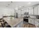 Well-lit kitchen with stainless steel appliances, modern fixtures, and a spacious island at 27467 Cinderella Cir, Lancaster, SC 29720