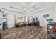 Bright living room featuring a decorative ceiling, wood flooring, and neutral paint at 27467 Cinderella Cir, Lancaster, SC 29720