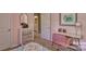 This pink bedroom features a study desk, neutral walls and ensuite access at 3060 Ora Smith Rd, Lincolnton, NC 28092