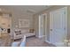 Bonus room featuring a couch, neutral walls and carpet, and a world map at 3060 Ora Smith Rd, Lincolnton, NC 28092
