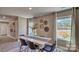 Bright dining room with modern decor, stylish table setting, and ample natural light from large windows at 3060 Ora Smith Rd, Lincolnton, NC 28092