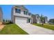 View of a modern two-story home featuring a two-car garage and landscaped front yard in a suburban area at 3060 Ora Smith Rd, Lincolnton, NC 28092