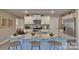 Kitchen featuring a granite island with seating, stainless steel appliances, and ample counter space at 3060 Ora Smith Rd, Lincolnton, NC 28092