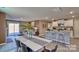 View of an open floor plan, connecting the dining area to the kitchen with modern appliances and decor at 3060 Ora Smith Rd, Lincolnton, NC 28092