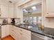 Elegant kitchen with granite countertops, a stainless steel dishwasher, and white cabinetry at 316 Robmont Rd, Charlotte, NC 28270