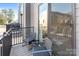 Cozy outdoor balcony featuring stylish chairs and a small table with views of the surrounding neighborhood at 3729 S Tryon St, Charlotte, NC 28217