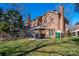 Brick home with a cozy patio area, complete with outdoor seating and a well-maintained lawn at 4151 Ivystone Ct, Charlotte, NC 28277
