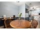 Bright dining area adjacent to the kitchen, featuring a round wood table at 4151 Ivystone Ct, Charlotte, NC 28277