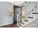 Inviting entryway with hardwood floors, staircase, and a front door welcoming natural light at 4151 Ivystone Ct, Charlotte, NC 28277