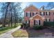 Charming brick townhome featuring black shutters and beautiful landscaping at 4151 Ivystone Ct, Charlotte, NC 28277
