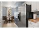 Kitchen view with stainless steel appliances, white cabinets, and dining area with natural light at 4151 Ivystone Ct, Charlotte, NC 28277