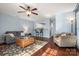 Open-concept living room with hardwood floors and bar seating to the kitchen area at 4151 Ivystone Ct, Charlotte, NC 28277