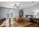 Cozy living room with hardwood floors, French doors, and a decorative rug at 4151 Ivystone Ct, Charlotte, NC 28277