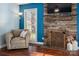 Comfortable living room showing a stone fireplace and natural lighting from a window at 4151 Ivystone Ct, Charlotte, NC 28277