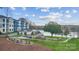 Beautiful waterfront apartment complex with a welcoming outdoor seating area and lush landscaping at 4387 Reed Creek Dr, Sherrills Ford, NC 28673