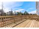 An expansive wooden deck with a scenic view of the woods, ideal for outdoor entertaining and relaxation at 4391 Reed Creek Dr, Sherrills Ford, NC 28673