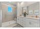 Bathroom with a double sink vanity, stone countertops, framed mirrors and a glass enclosed shower providing elegance at 4391 Reed Creek Dr, Sherrills Ford, NC 28673