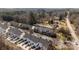 Aerial view of a group of townhouses, showing rooftops and proximity to neighborhood streets at 604 Atherton Way, Rock Hill, SC 29730