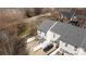 Aerial view shows a townhouse with a concrete patio, white fence, shed and black car in the driveway at 604 Atherton Way, Rock Hill, SC 29730