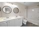 Bathroom boasts double sinks, round mirrors, and a shower-tub combination at 604 Atherton Way, Rock Hill, SC 29730