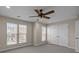 This bedroom offers natural light through three windows and includes a ceiling fan at 604 Atherton Way, Rock Hill, SC 29730