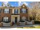 Charming two-story brick home with a welcoming front porch and a well-maintained, attractive yard at 604 Atherton Way, Rock Hill, SC 29730