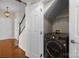 Near the stairs, there's a convenient laundry room with a modern washer at 604 Atherton Way, Rock Hill, SC 29730