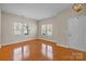 Bright living room with hardwood floors, large windows, and ample natural light at 604 Atherton Way, Rock Hill, SC 29730