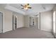 Large main bedroom featuring neutral walls, carpet, and a doorway leading to closet and bath at 604 Atherton Way, Rock Hill, SC 29730