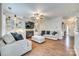 Spacious living room featuring built-in shelving, a fireplace, and modern furnishings at 7028 Lowen Rd, Charlotte, NC 28269