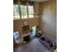 Bright living room boasts high ceilings, fireplace, and abundant natural light at 7135 Tabor Falls Dr, Harrisburg, NC 28075