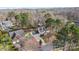 Aerial view of a home showcasing a well-manicured lawn and traditional exterior with black shutters at 7201 Brassy Creek Ln, Charlotte, NC 28269