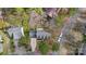 Aerial view of a neighborhood showing rooftops, driveways, and mature trees at 7201 Brassy Creek Ln, Charlotte, NC 28269