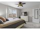 Comfortable bedroom with a ceiling fan, window and a neutral color scheme at 7201 Brassy Creek Ln, Charlotte, NC 28269
