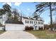 Traditional home with a well-manicured lawn, two-car garage, and a classic white facade at 7201 Brassy Creek Ln, Charlotte, NC 28269