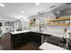Updated kitchen featuring dark cabinetry, stainless appliances, and modern countertops at 7201 Brassy Creek Ln, Charlotte, NC 28269