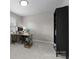 Office space with a desk, rolling chair, and storage at 7201 Brassy Creek Ln, Charlotte, NC 28269