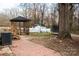 A wooden gazebo is featured in this backyard with recreational equipment at 781 Niblick Dr, Gastonia, NC 28054