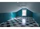 Finished attic space features paneled walls, recessed lighting, and a checkered floor pattern at 802 Lewis St, Gastonia, NC 28054