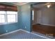 Inviting room featuring hardwood flooring, natural light, and an open doorway at 802 Lewis St, Gastonia, NC 28054