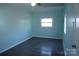 Light blue bedroom with natural light and vinyl flooring at 802 Lewis St, Gastonia, NC 28054