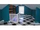 Bright bonus room features a wooden accent wall and checkerboard flooring at 802 Lewis St, Gastonia, NC 28054