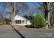 Home with screened-in porch and mature trees in a beautiful neighborhood at 802 Lewis St, Gastonia, NC 28054