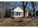 Charming home with screened-in porch, large yard, and mature trees at 802 Lewis St, Gastonia, NC 28054