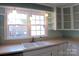 Bright kitchen featuring stainless steel appliances, white cabinets and an island at 802 Lewis St, Gastonia, NC 28054