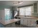 Bright kitchen featuring stainless steel appliances, white cabinets and an island at 802 Lewis St, Gastonia, NC 28054