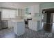 Bright kitchen featuring stainless steel appliances, white cabinets and an island at 802 Lewis St, Gastonia, NC 28054