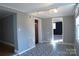 Open-concept living room with unique flooring and recessed lighting at 802 Lewis St, Gastonia, NC 28054