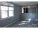 Bright living room with patterned flooring, neutral paint, and natural light at 802 Lewis St, Gastonia, NC 28054
